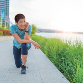 Healthy active woman kneeling one knee on the ground