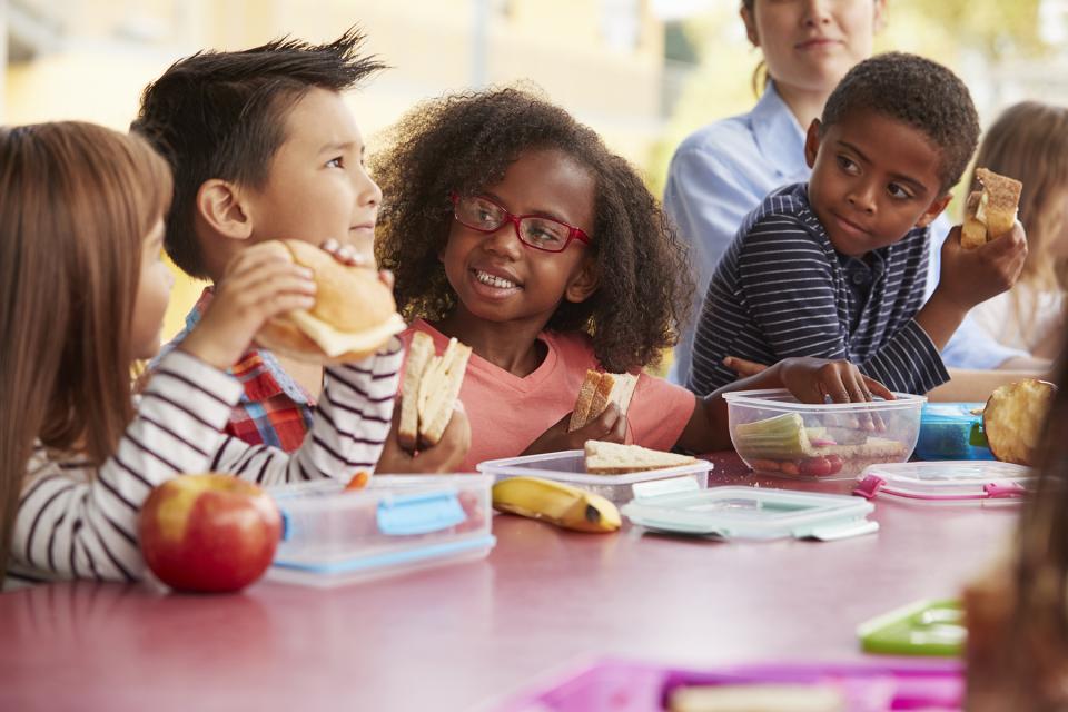 Children eating at a table together