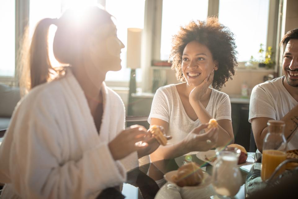 friends smiling and eating together