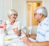 Elderly couple enjoying breakfast together