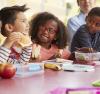 Children eating at a table together